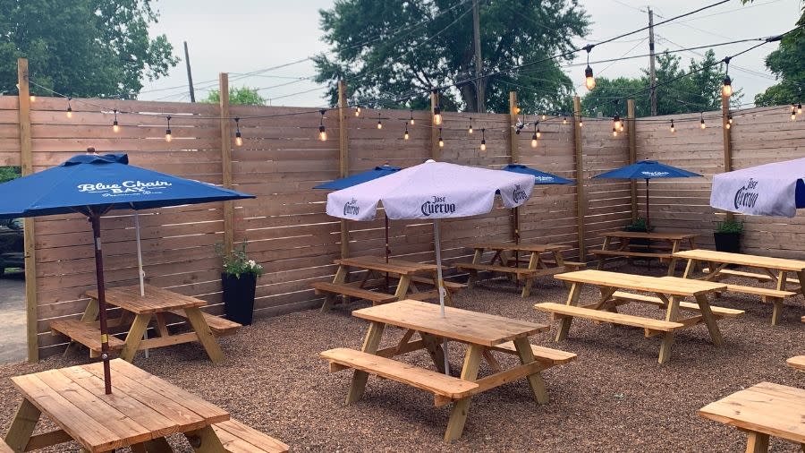 Empty picnic tables at the 1718 patio