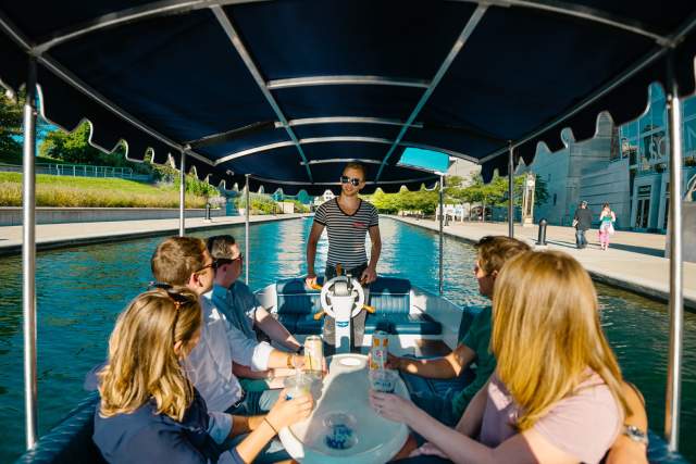 Visitors enjoy a guided cocktail cruise on the Central Canal