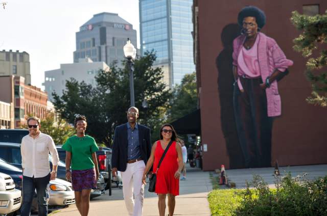 The mural of Indianapolis poet Mari Evans looms over visitors to Mass Ave