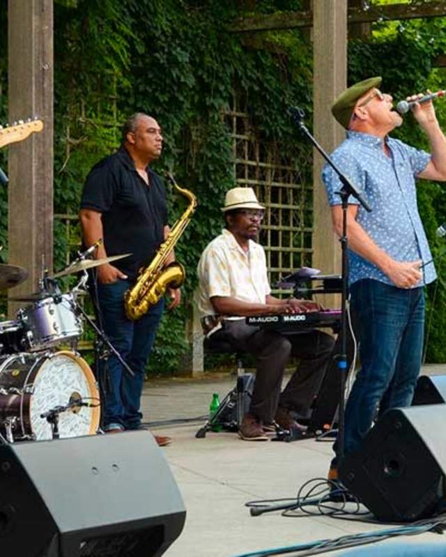 Three men playing jazz on a stage