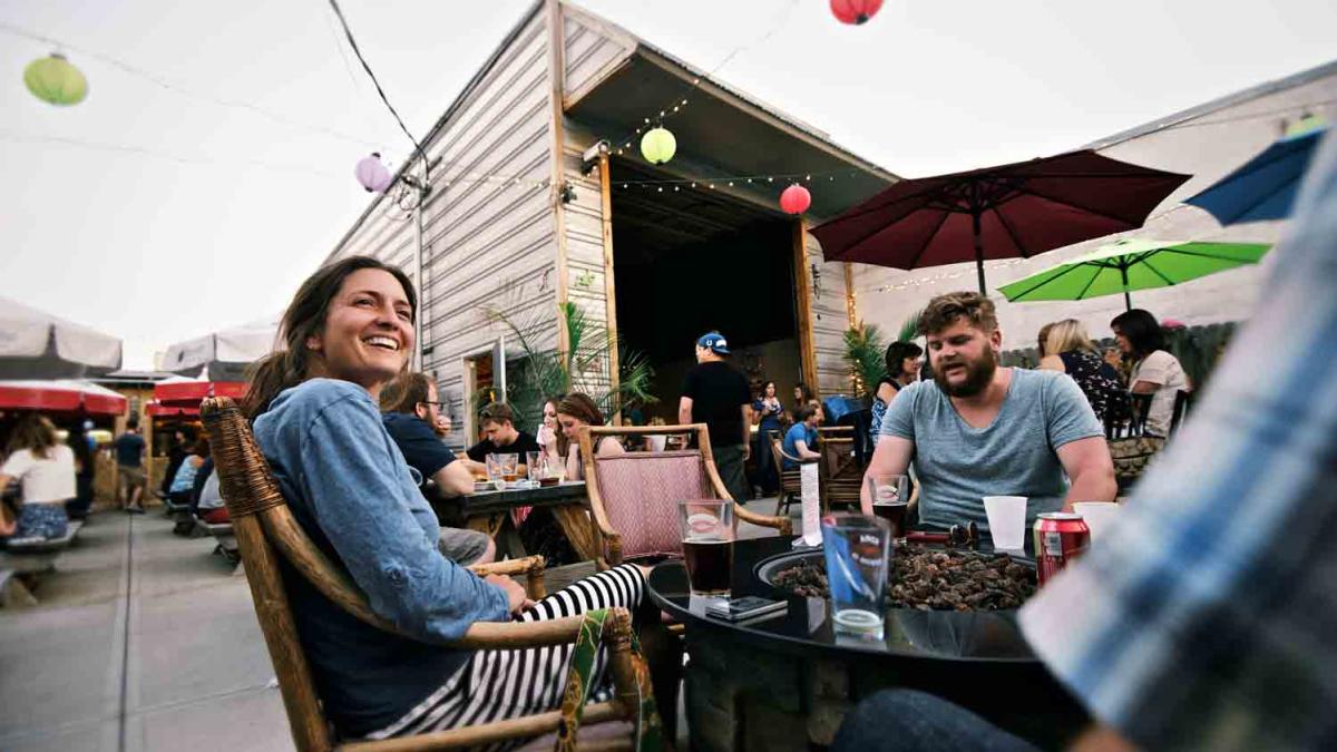 A Couple Enjoying The La Revolucion patio