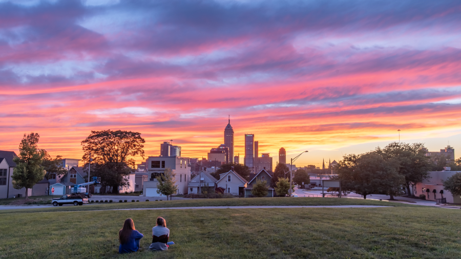 Two People In a park looking at the Indianapolis sky line