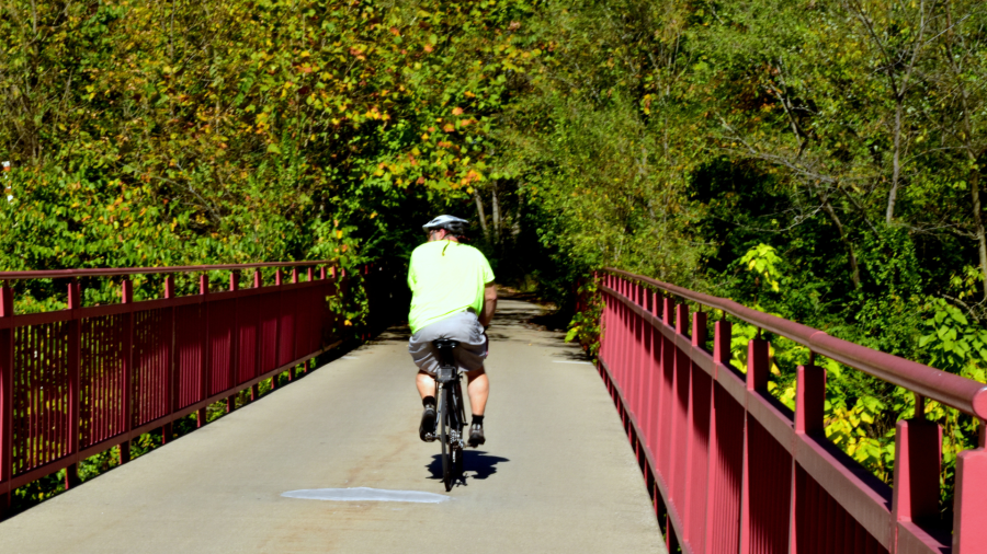 man biking the Monon rail trail